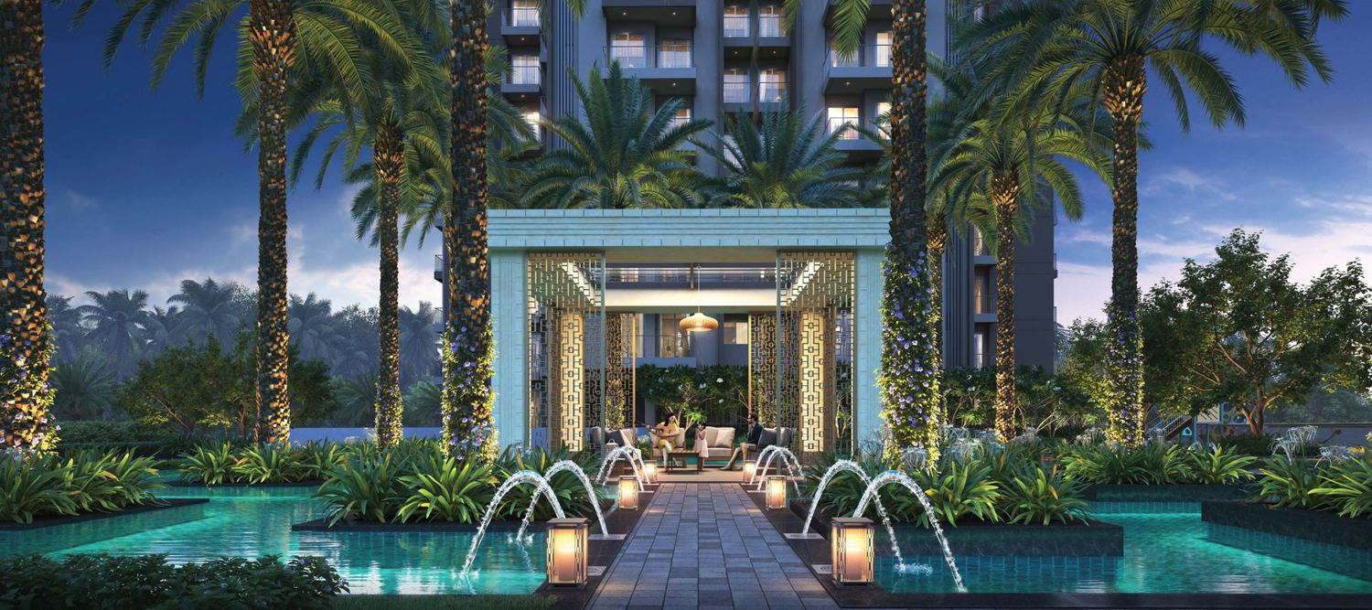 Palm court with fountains and a lit pavilion