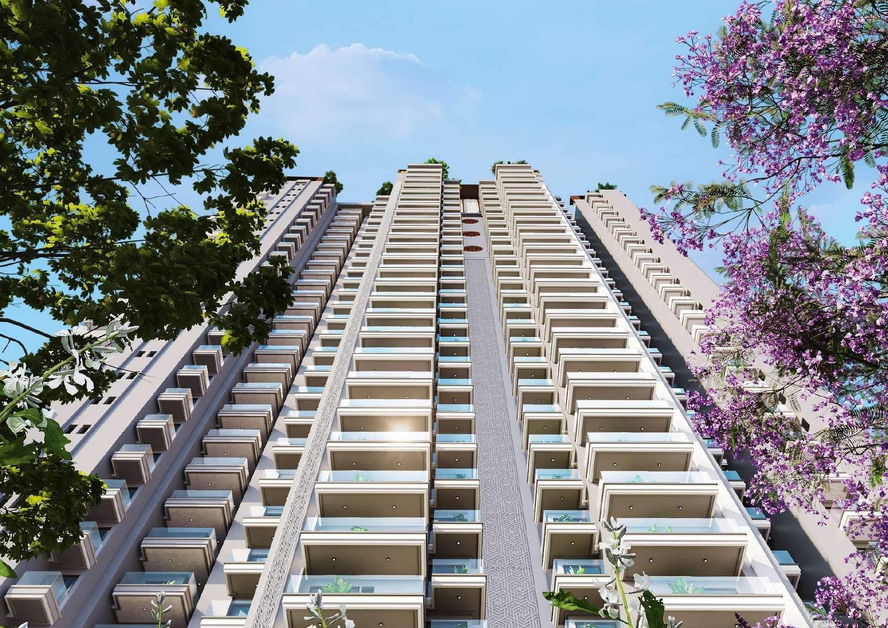 Vridhi+ Premium Tower rising above jacaranda trees